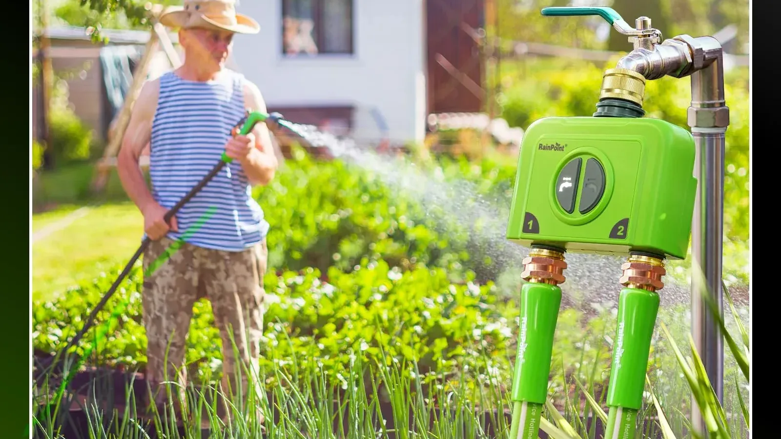 Garden tap with a water timer attached, watering a garden while a person holds a hose in the background.